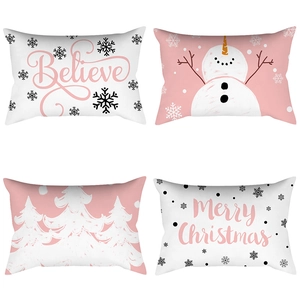Set of four pink Christmas lumbar pillow covers with snowman and Believe prints