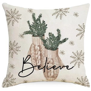 Christmas cushion cover featuring knit gloves, pine branches and Believe slogan