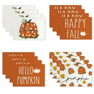 Set of 16 Thanksgiving placemats with pumpkins and autumn leaves on white background