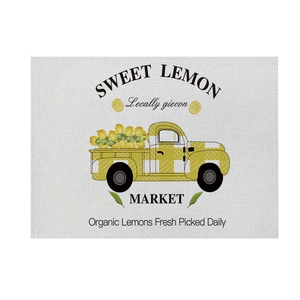 Linen placemat with vintage yellow lemon truck print for summer table decor