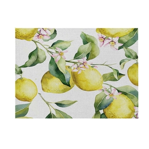 Linen placemat with vibrant lemon and floral watercolor print for summer table decor