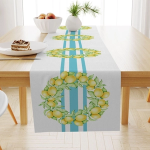 Linen table runner with lemon print and blue stripes on a wooden dining table