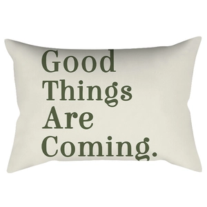 Beige lumbar pillow with green Good Things Are Coming text in Nordic style