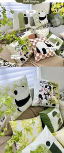 Detailed view of Nordic sage green geometric cushion covers on a sofa in a modern room