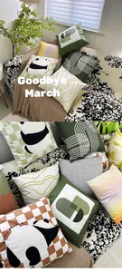 Detail showing Nordic green geometric pillow covers with lazy panda print on a cozy sofa