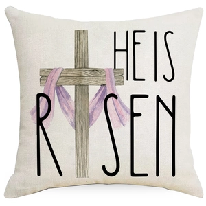 Easter linen pillow cover with wooden cross and He Is Risen text design on white background