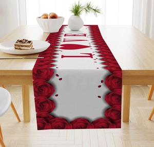 Close-up of Valentine table runner with red roses and LOVE print on wood table