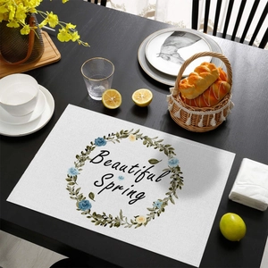 Waterproof linen placemat with round floral wreath and Beautiful Spring text on wood