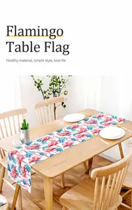Detailed texture of linen table runner with pink flamingo and tropical palm leaf print