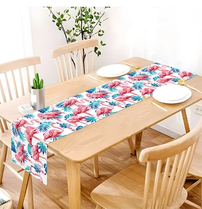 Detail of flamingo and palm leaf print on high-quality linen table runner fabric