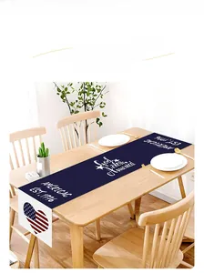 Detailed view of linen Independence Day table runner with God Bless America print