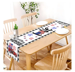Detail of linen table runner with red truck, American flag heart and God Bless America text