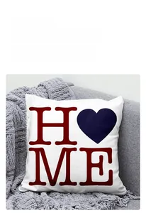 Close-up of a linen HOME pillowcase on a grey sofa for Independence Day home decor