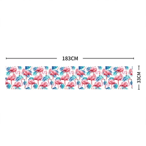 Tropical flamingo and palm leaf print linen table runner measuring 183x33cm for summer decor