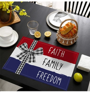 Detail of rectangular place mat with Faith Family Freedom text and checkered bow decoration