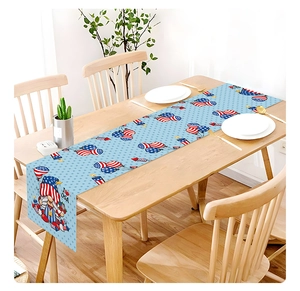 Detailed view of Fourth of July gnome table runner with I Love USA print on wood table