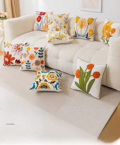 Detailed embroidery texture of the floral series pillowcase on a fabric sofa