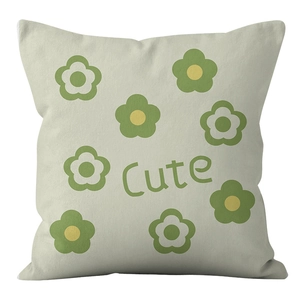 Detail of the soft fabric texture and cute green flower print on the square pillow case