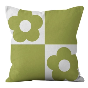 Detail of green floral checkered cushion cover made of soft plush velvet material