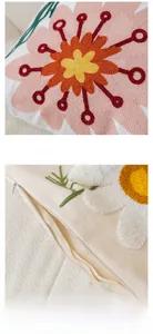 Detail of floral embroidery and tufted petal texture with invisible zipper on cushion cover