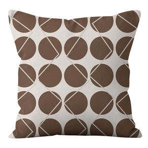 Close-up of modern geometric cushion cover with brown dots and square patterns