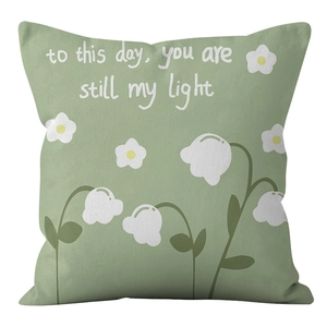 Detailed view of Morandi green velvet pillowcase with white lily flowers and text