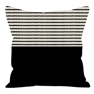 Detail of Nordic geometric brown pillowcase with black and white striped pattern
