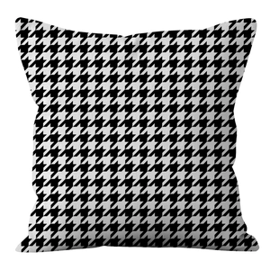 Detailed view of the houndstooth pattern fabric and texture on the square cushion cover