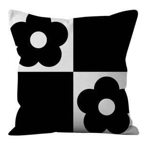 Close-up of black and white checkerboard pillowcase with modern floral pattern detail