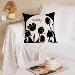 Nordic minimalist black and white tulip decorative pillow placed on a white sofa