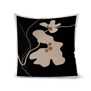 Detail of square pillowcase featuring black base with beige and brown abstract art pattern