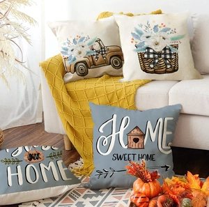 Set of four farmhouse style linen throw pillows with home sweet home and truck patterns