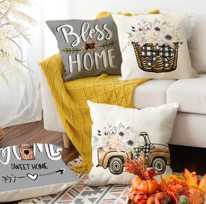 Close-up detail of linen Thanksgiving pillow cover with Bless Our Home and floral pickup truck