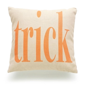 Halloween decorative linen pillow cover with orange Trick lettering and natural texture