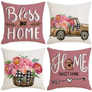 Four-piece linen pillow covers set with pink peonies and Bless Our Home slogans