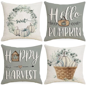 Four Thanksgiving pillow covers with autumn pumpkin motifs in linen style texture