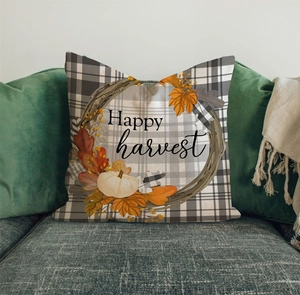Detailed view of linen pillowcase with white pumpkin wreath and Happy Harvest slogan