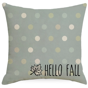 Detail of linen pillowcase with multi-color dots and black Hello Fall text print