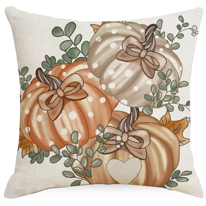 Linen Thanksgiving pillow cover featuring autumn pumpkins with dots and maple leaves
