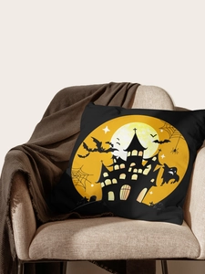 Detail of Halloween pillow case with castle and bat print on a cozy beige sofa chair