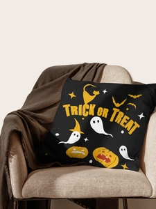 Detail of Trick or Treat Halloween pillowcase on a cozy sofa with brown knitted blanket