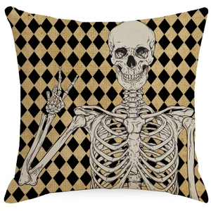 Close-up of Halloween pillow cover with skull hand illustration and diamond patterns