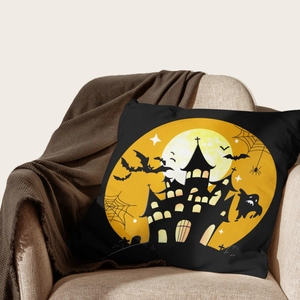 Halloween decorative pillowcase with black castle and yellow moon on a cozy sofa