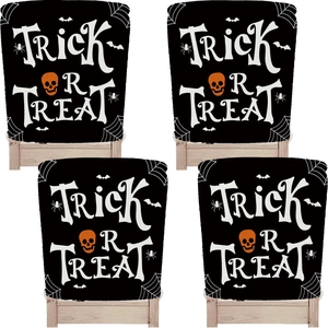 Detail of Halloween chair covers featuring Trick or Treat text and orange skull patterns