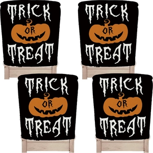 Detail of Halloween chair covers featuring Trick or Treat text and pumpkin motifs