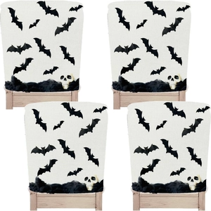 Detailed close-up showing the linen texture and bat patterns of Halloween chair covers