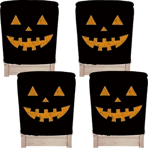 Set of 4 Halloween chair covers with orange pumpkin jack-o'-lantern face patterns