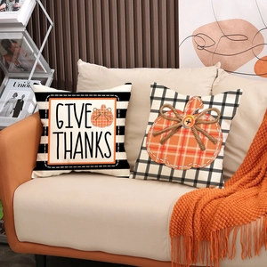 Detail of Thanksgiving pillow covers with Give Thanks text and 3D pumpkin bow design