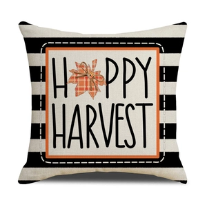 Striped Thanksgiving pillow cover with Happy Harvest text and maple leaf decoration
