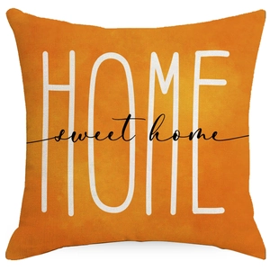 Detail of the linen texture and Sweet Home typography on the orange pumpkin pillow cover